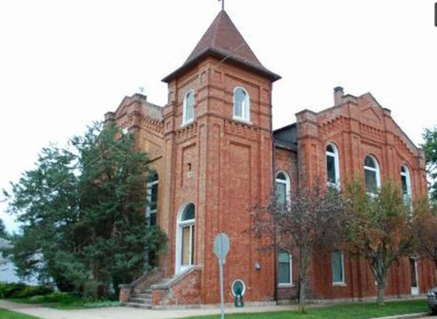 Unique Converted Church for Sale: Original Features Intact, Including Organ, Bell, and Stained-Glass Windows