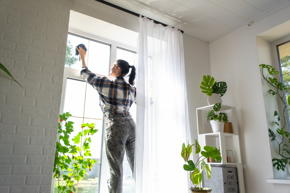 Woman,Manually,Washes,The,Window,Of,The,House,With,A