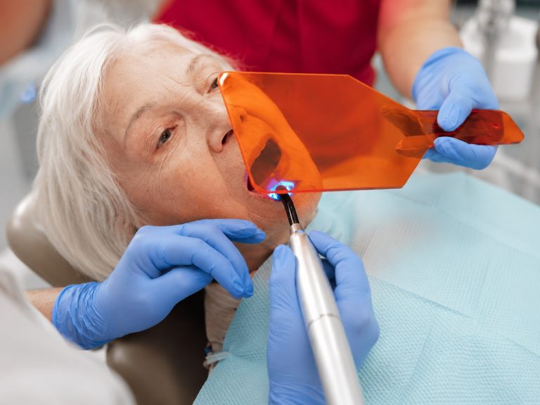Everything You Should Know Before Your Next Dental Check-Up Dentist carrying out a routine dental check-up for a patient in Wimbledon