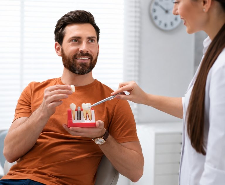 The Role of a Dentist in Maintaining Overall Health Dental practice Wimbledon dentist carrying out a routine oral health examination
