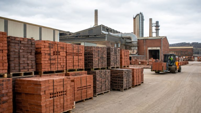 UK brick market with stacked bricks at a British manufacturing and supply yard
