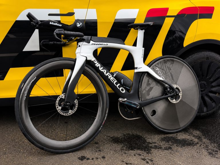 High-performance road bike with carbon wheels in a cycling showroom