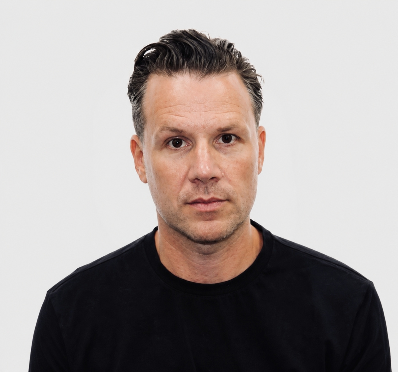 Benjamin Hall, founder of LOFT, wearing a black shirt against a plain background