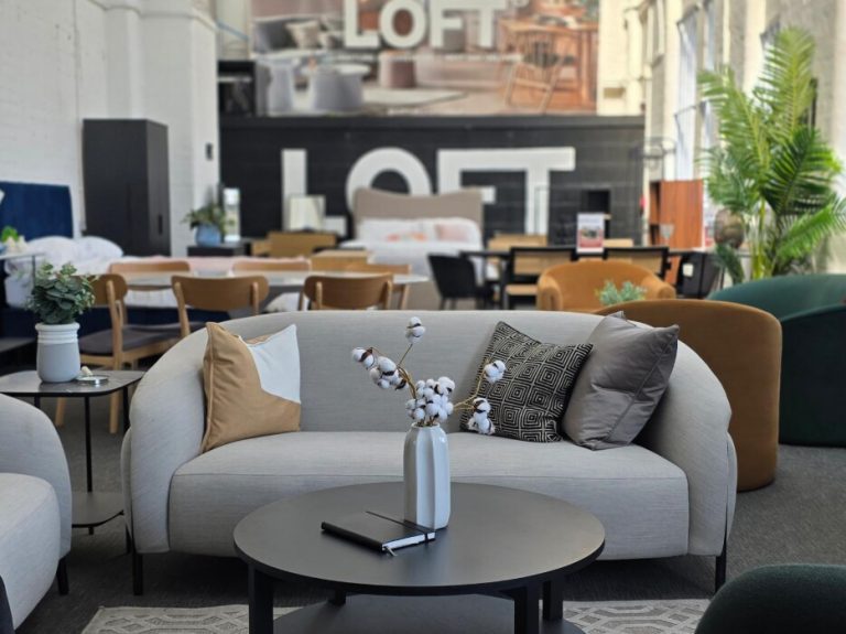 Student housing is defending occupancy with discounts. There is a cheaper way. Modern furnished student accommodation showroom with sofa, tables and seating
