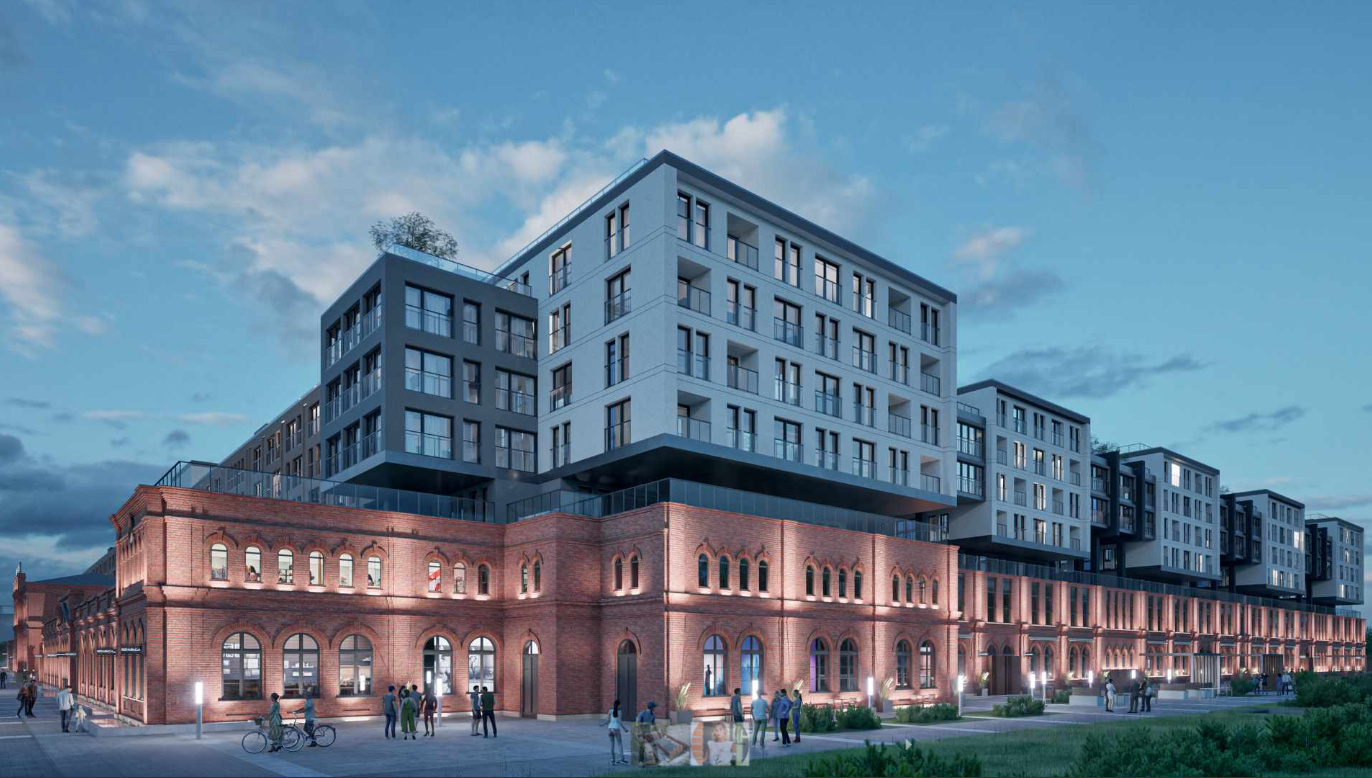 Nowa Tkalnia in Łódź, Poland, showing modern apartments above a historic red-brick façade at dusk